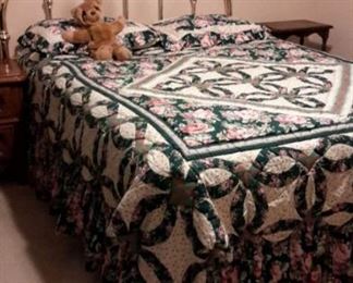 Queen brass headboard and beautiful quilt. (Mattress not for sale)