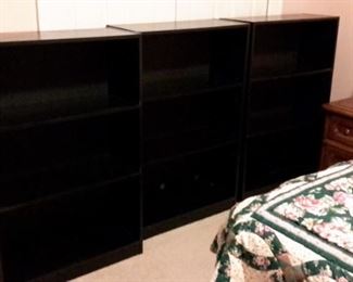 Three matching bookshelves.