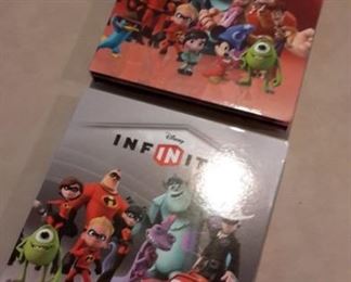 Disney Infinity character game pieces, in boxes.