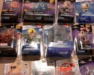 Disney Infinity figures and power packs, new in box.