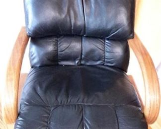 Very nice oak table with four real leather swivel chairs on casters. One leaf.