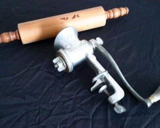 Vintage rolling pin and meat grinder.
