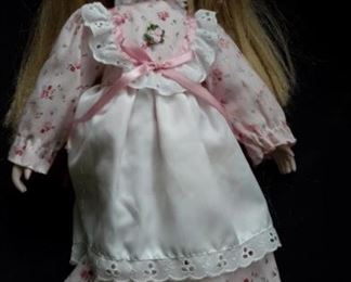 Musical porcelain (body soft) doll. Plays "You Light Up My Life".