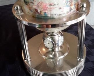 Precious stone globe and clock.