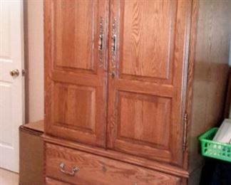 Oak armoire/TV cabinet with 4 drawers (one felt-lined drawer for jewelry) and mirror.