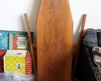 Vintage metal dollhouse and wood ironing board.