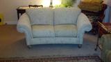 Two curved back loveseats