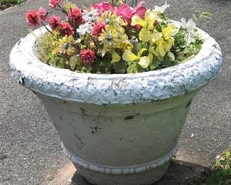 One of several matching large concrete pots