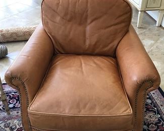 One of four matching leather chairs