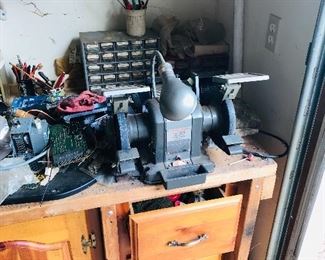 Dual shop grinder mounted on workbench