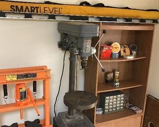 Smart level, variety of duct tape’s masking tape’s and drafting tape and Columbia five-speed heavy duty drill press