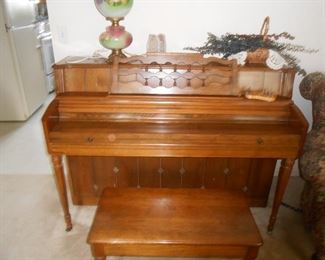 This piano is gorgeous! Solid wood, mid-century detailing.