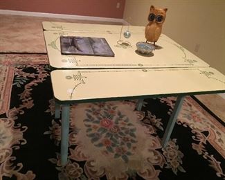 Black rug and antique table
