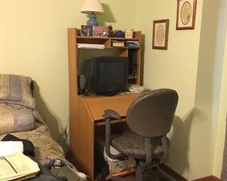 small desk, office chair, lamp, artwork