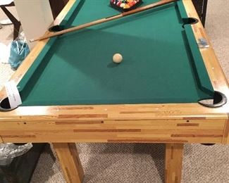 Small pool table in excellent condition, with balls and 2 cues as well as chalk