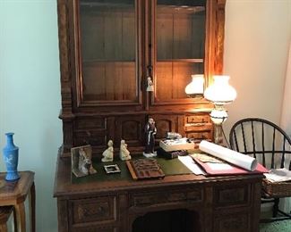 Extraordinary secretary with glass doors and leather topped writing surface.  Hidden compartment 