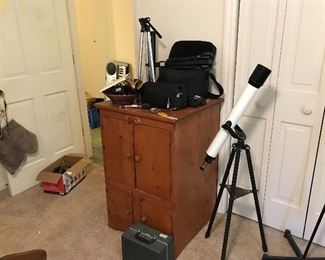 Telescope and cabinet with shelves