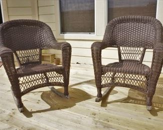 Two of several wicker rockers