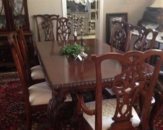 This gorgeous dining table has 8 chairs.