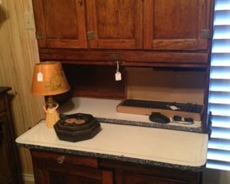 Hoosier cabinet  - a type of cupboard or free–standing kitchen cabinet that also serves as a workstation.