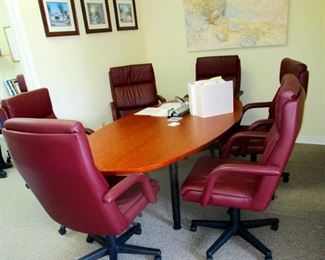Conference table with six leather swivel chairs