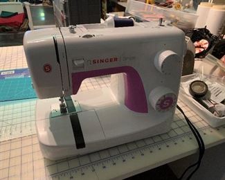 sewing machines including a serger 