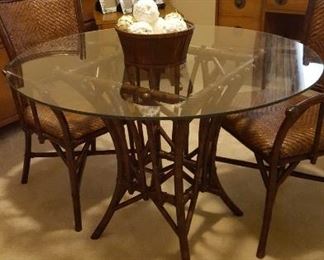 Glass top bamboo table and two chairs, twin beds, and mid-century desk