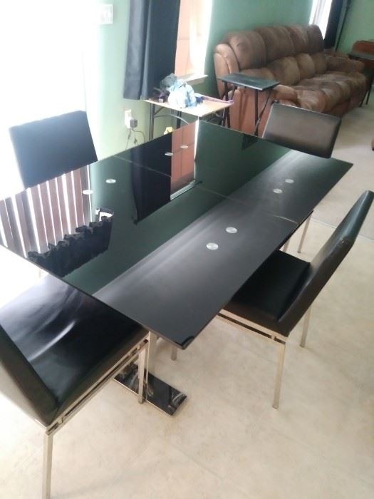 Black lacquer table and four matching chairs