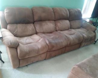 Four seat leather couch With recliners on each end