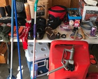 Full packs a brand new army sucks, Budweiser suspenders,  10 gallon gas can mounted on wheels and brooms and mops