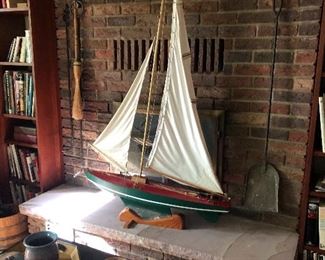 Hand crafted boat with building blueprints.