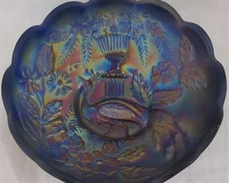 Peacock at urn carnival bowl


