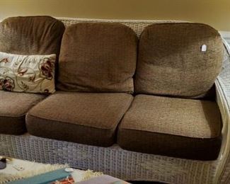 wicker sofa with cushions, in living room