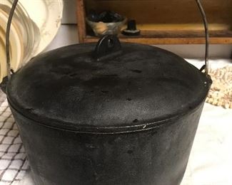 Deep Cast Iron Dutch Oven....also, cast iron pans and cornbread stick pans