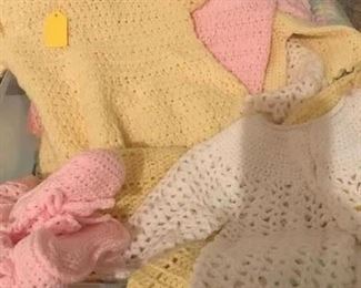 Many crochet baby outfits...sweaters, hats, dresses, booties and etc