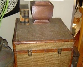 Caned Trunk with leather trim and wood wheels, removable upper tray insert.