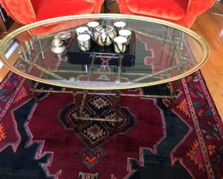 Baker Faux Bamboo base with oval Brass and Glass top. c. 1960.