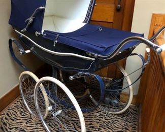 English Marmet Pram, very good condition with new suspension belts, brake pads, mattress and cover. Also has weather cover with wind blind, harness for baby, and diaper bag that attaches under front carriage. Purchased in 1973, Andersonville Baby shop.