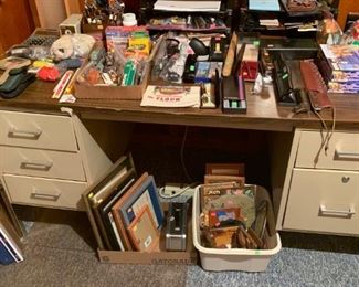 large metal desk and miscellaneous items