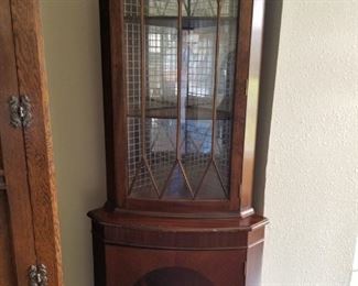 Beautiful, hand painted black trim, (very popular and eclectic style), corner curio cabinet. 