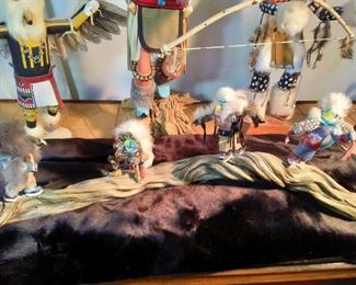 Kachina Dolls on a Log 