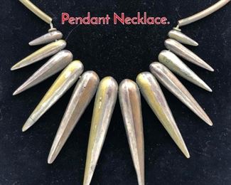 Lot 131 Modernist Artisan Mixed Metals Pendant Necklace. 