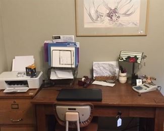 Vintage desk and Montgomery Wards rolling desk chair, wooden file cabinet, rose lamp and Georgia O'Keeffe's 1938 "From the Faraway, Nearby" framed print.