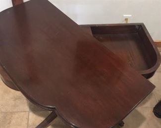 Vintage game table turning to show storage underneath