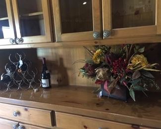 Wine rack and decorative wine bottle, flower arrangements