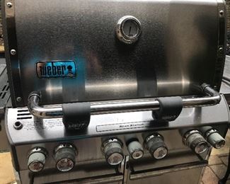 Large Weber natural gas grill on locking wheels