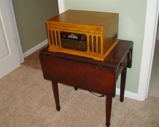 antique walnut drop leaf table and 30's style radio.