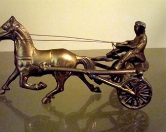 Antique cast iron horse and buggy.