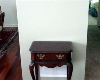 Cherry hall stand and brass wall hanging.