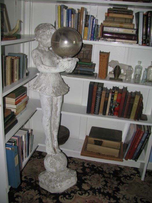 Cement girl holding gazing ball